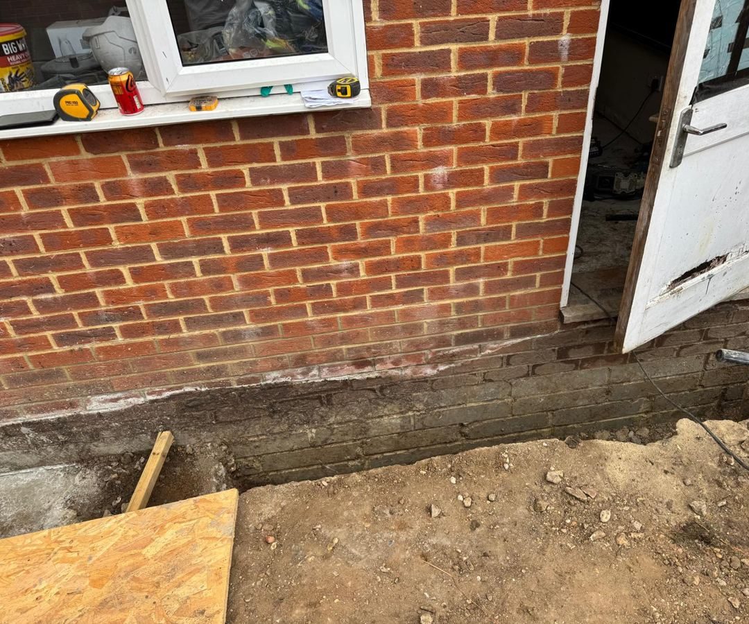 Footing trench excavated along the existing brickwork
