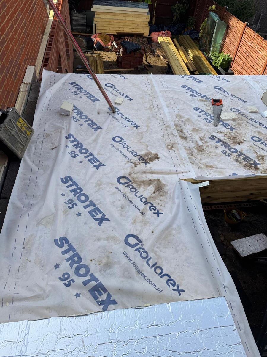 Breathable membrane laid over the new roof