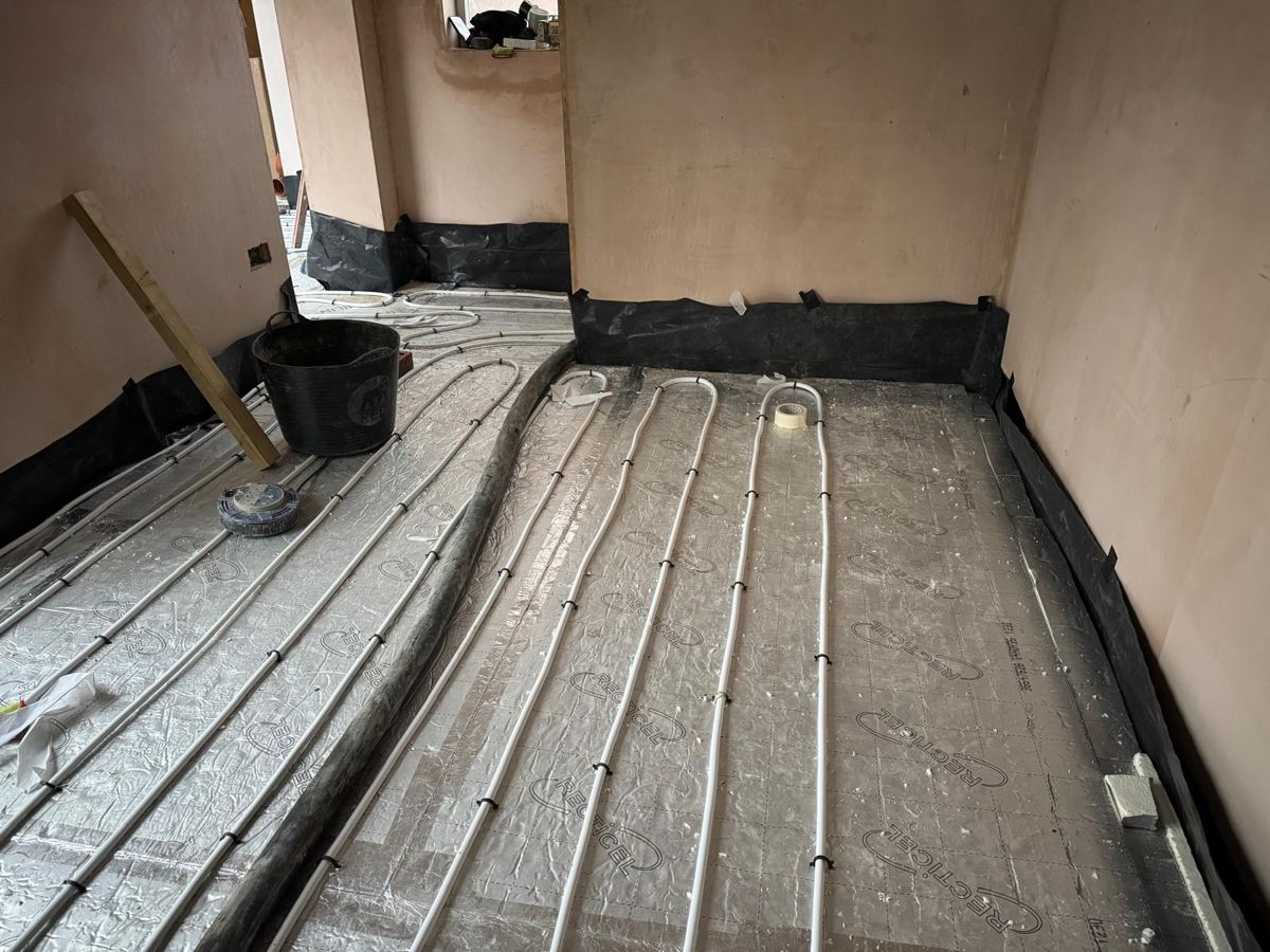 Underfloor heating pipework laid ready for screed