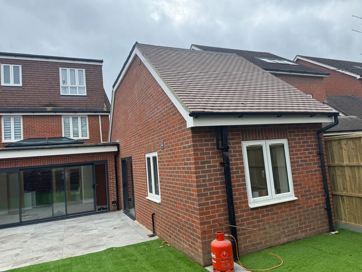 Completed extension with new tiled roof and white windows